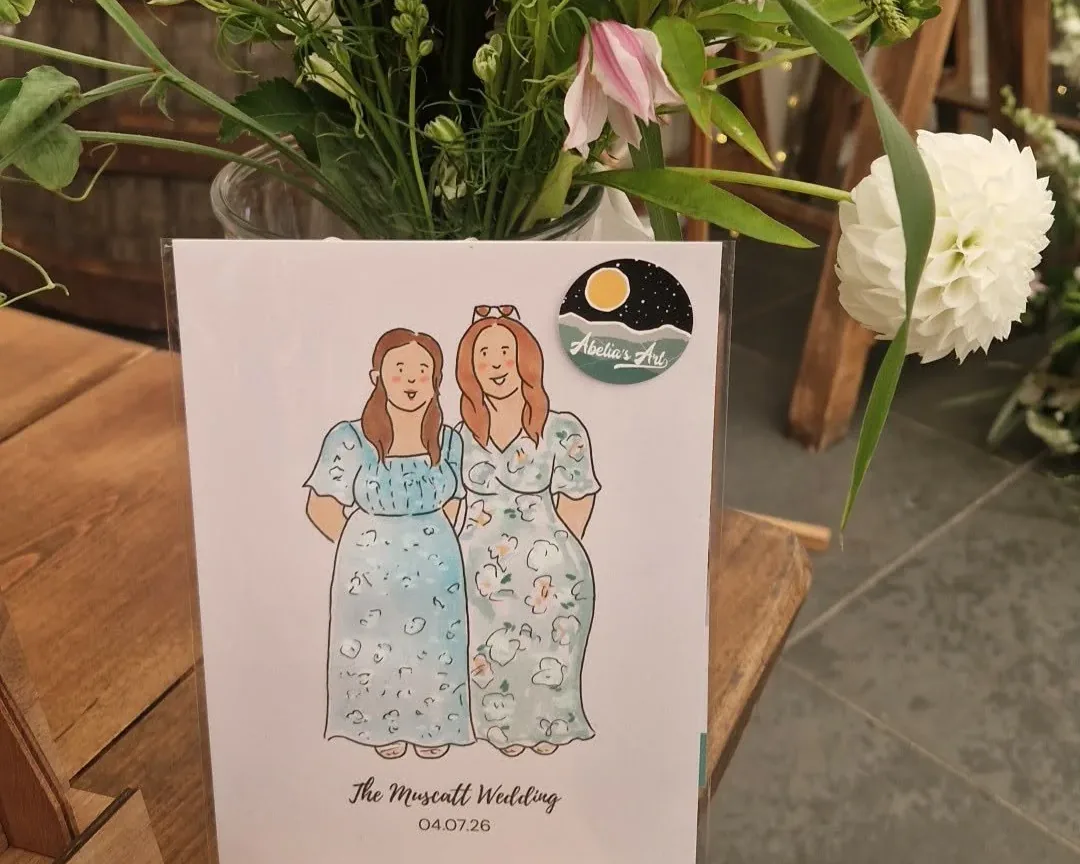 Guest portraits displayed on the live illustration table at Trevenna Barns