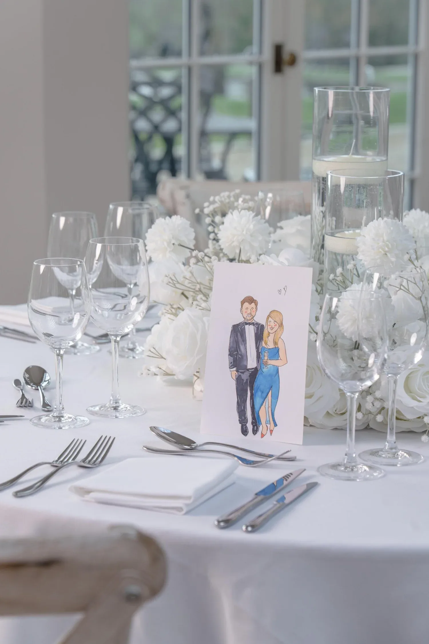 Wedding couple illustration propped on an easel
